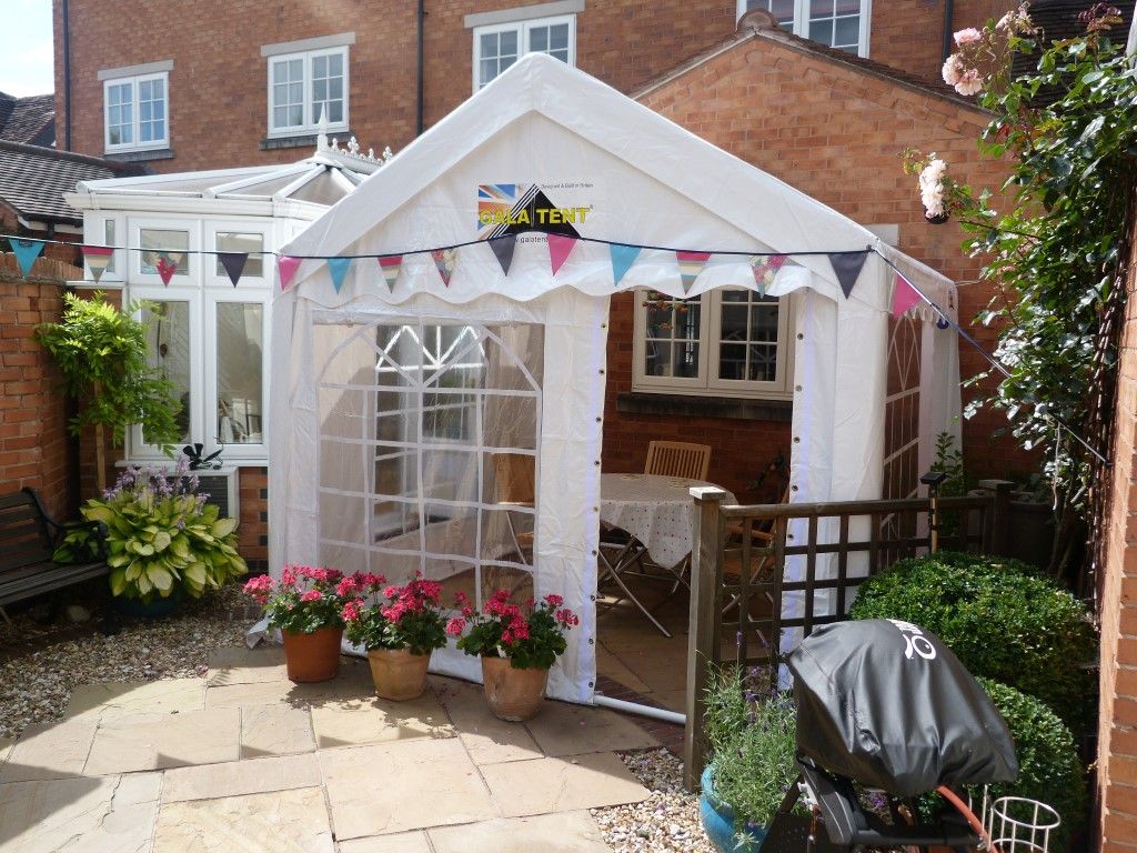 Mr & Mrs Butler enjoying their new windowed end panel as a summer house.